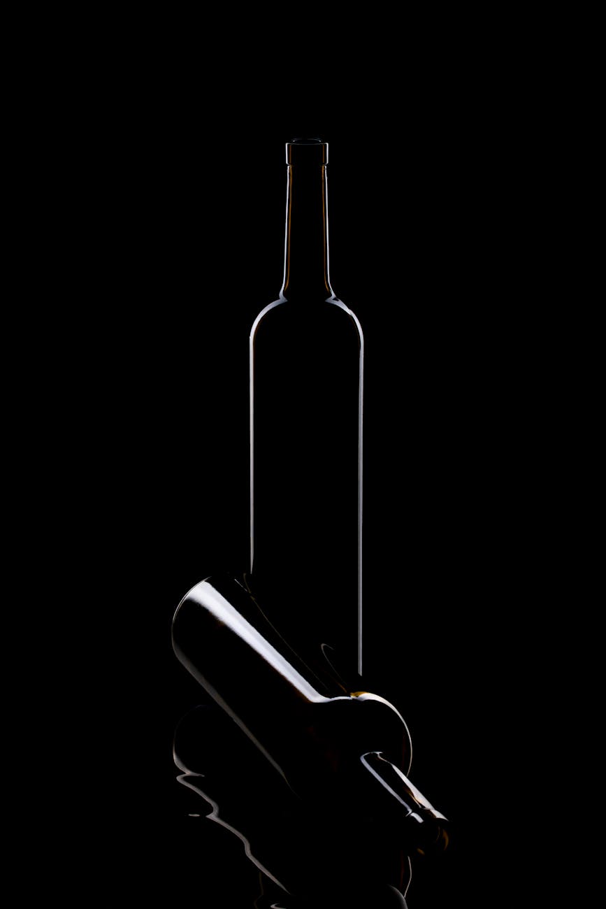 Hand holding a wine glass with pale white wine during a professional tasting